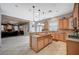 Open-concept kitchen features center island and seamless transition into living room at 8093 Luna Sera Ave, Las Vegas, NV 89178