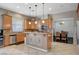 Bright kitchen with a center island, stainless appliances, and adjacent dining area at 8093 Luna Sera Ave, Las Vegas, NV 89178