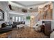Spacious living room featuring a vaulted ceiling, staircase, and balcony overlooking the seating area at 8093 Luna Sera Ave, Las Vegas, NV 89178