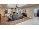 Cozy living room featuring a stone fireplace, wood-look floors, and modern furnishings at 8093 Luna Sera Ave, Las Vegas, NV 89178