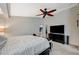Bright and airy main bedroom with ceiling fan, carpet, and a minimalist aesthetic, promoting calm and comfort at 8093 Luna Sera Ave, Las Vegas, NV 89178