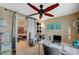 Functional office featuring a ceiling fan, workstation, and storage, ideal for remote work or study at 8093 Luna Sera Ave, Las Vegas, NV 89178