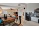 Open concept area with a home office, bedroom, and kitchenette, with a ceiling fan for added comfort at 8093 Luna Sera Ave, Las Vegas, NV 89178