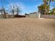 Large, gravel backyard with a storage shed and a block wall for privacy at 810 Kenny Way, Las Vegas, NV 89107