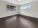Bedroom features laminate floors and large windows at 810 Kenny Way, Las Vegas, NV 89107