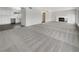 Large, open living room featuring a brick fireplace and access to kitchen at 810 Kenny Way, Las Vegas, NV 89107