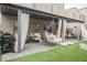 Charming backyard space featuring a covered patio with stylish decor and comfortable seating at 8890 Bonneville Peak Ct, Las Vegas, NV 89148