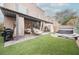 A well-designed backyard with an outdoor kitchen, pergola, lounge chairs and a hot tub at 8890 Bonneville Peak Ct, Las Vegas, NV 89148