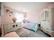 Charming bedroom with pink walls, plush decor, and an inviting mermaid themed bed at 8890 Bonneville Peak Ct, Las Vegas, NV 89148