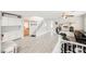 Spacious, bright bonus room with wood floors, storage, ceiling fan, and exercise equipment at 8890 Bonneville Peak Ct, Las Vegas, NV 89148