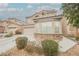 Two-story home with a two-car garage, stone accents, and well-maintained landscaping in a Gathering-friendly neighborhood at 8890 Bonneville Peak Ct, Las Vegas, NV 89148