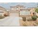 Charming two-story home features a well-manicured front yard, and inviting curb appeal at 8890 Bonneville Peak Ct, Las Vegas, NV 89148