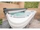 Inviting hot tub with an open cover nestled in a private outdoor setting at 8890 Bonneville Peak Ct, Las Vegas, NV 89148