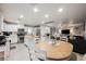 Bright open-concept kitchen with stainless steel appliances, central island, and an adjacent dining and living area at 8890 Bonneville Peak Ct, Las Vegas, NV 89148