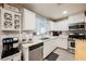 Charming kitchen features bright white cabinetry, white countertops, stainless steel appliances, and a coffee bar at 8890 Bonneville Peak Ct, Las Vegas, NV 89148