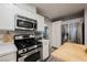 This kitchen features stainless steel appliances, including a gas range, microwave, and stainless steel refrigerator at 8890 Bonneville Peak Ct, Las Vegas, NV 89148