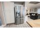 A stainless steel refrigerator provides a modern look, enhancing the functionality of this open-concept kitchen space at 8890 Bonneville Peak Ct, Las Vegas, NV 89148