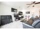Spacious entertainment area with multiple TVs, leather seating, and a dart board at 8890 Bonneville Peak Ct, Las Vegas, NV 89148