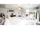 Bright primary bedroom featuring plush carpet, decor, and bathroom access at 8890 Bonneville Peak Ct, Las Vegas, NV 89148
