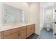 Modern bathroom with double sink vanity, spacious countertop, and designer black and white tiled floors at 8979 Rolling Pietra St, Las Vegas, NV 89166