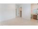 Open bedroom layout with access to a closet and a modern bathroom showcasing tiled flooring at 8979 Rolling Pietra St, Las Vegas, NV 89166