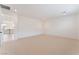 Large bedroom with neutral carpet, recessed lighting, and an adjacent staircase, perfect for relaxation at 8979 Rolling Pietra St, Las Vegas, NV 89166