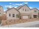 Charming two-story home featuring a neutral exterior, brick driveway, complemented by a well-manicured landscape at 8979 Rolling Pietra St, Las Vegas, NV 89166