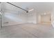 The garage space has finished concrete floors, and an automatic garage door opener at 8979 Rolling Pietra St, Las Vegas, NV 89166