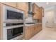 Gourmet kitchen with stainless steel appliances and custom cabinetry providing ample storage at 8979 Rolling Pietra St, Las Vegas, NV 89166