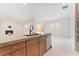 Bright open kitchen with stone countertops, stainless steel appliances, and large island with sink at 8979 Rolling Pietra St, Las Vegas, NV 89166