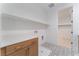 Featuring a laundry room with cabinets, counter space, and tile floors at 8979 Rolling Pietra St, Las Vegas, NV 89166