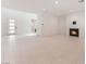 Open-concept living room with tile flooring, fireplace, and abundant natural light at 8979 Rolling Pietra St, Las Vegas, NV 89166