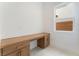 A built-in desk space in the office has storage drawers and a window at 8979 Rolling Pietra St, Las Vegas, NV 89166