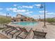 Resort-style pool with lounge chairs and pristine water, perfect for relaxing on sunny days at 8979 Rolling Pietra St, Las Vegas, NV 89166