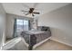 Bedroom has a large window with black-out curtains, fan, and comfortable bedding at 9180 Wine Cellar Ave, Las Vegas, NV 89148