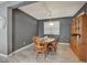 Dining area with a wooden table, chairs, and a traditional china cabinet at 9180 Wine Cellar Ave, Las Vegas, NV 89148