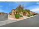 Street view of a well-maintained two-story home with desert landscaping and a two-car garage at 9180 Wine Cellar Ave, Las Vegas, NV 89148