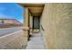 Close-up of the home's entrance with a dark green door and charming front steps at 9180 Wine Cellar Ave, Las Vegas, NV 89148