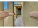Inviting entryway featuring a dark green front door and neutral-toned stucco walls at 9180 Wine Cellar Ave, Las Vegas, NV 89148