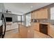 Kitchen with an island and an open view into the living room at 9180 Wine Cellar Ave, Las Vegas, NV 89148
