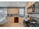 Kitchen with stainless steel appliances and access to the backyard at 9180 Wine Cellar Ave, Las Vegas, NV 89148