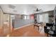 Spacious living room with wood floors and open layout, filled with natural light at 9180 Wine Cellar Ave, Las Vegas, NV 89148