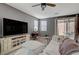 Comfortable living room with a large TV and plenty of natural light at 9180 Wine Cellar Ave, Las Vegas, NV 89148
