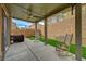 Relax on this covered patio featuring rocking chairs, a fan, and decorative accents at 9180 Wine Cellar Ave, Las Vegas, NV 89148