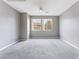 Bright, carpeted bedroom with large windows offering plenty of natural light at 9303 Gilcrease Ave # 1013, Las Vegas, NV 89149