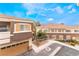 Attractive exterior view of townhomes, showcasing architecture and community landscaping at 9303 Gilcrease Ave # 1013, Las Vegas, NV 89149