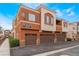 Charming townhome with a three-car garage and a beautifully designed terracotta exterior at 9303 Gilcrease Ave # 1013, Las Vegas, NV 89149