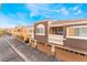 Street view featuring townhome architecture and attached garages at 9303 Gilcrease Ave # 1013, Las Vegas, NV 89149