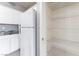 A kitchen with white cabinetry, granite countertops, and an adjacent pantry at 9303 Gilcrease Ave # 1013, Las Vegas, NV 89149