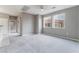 Spacious living room with modern grey walls and plush carpeting at 9303 Gilcrease Ave # 1013, Las Vegas, NV 89149